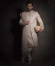 Heavily Embroidered Gold Fitted Pakistani Groom Sherwani in Raw Silk