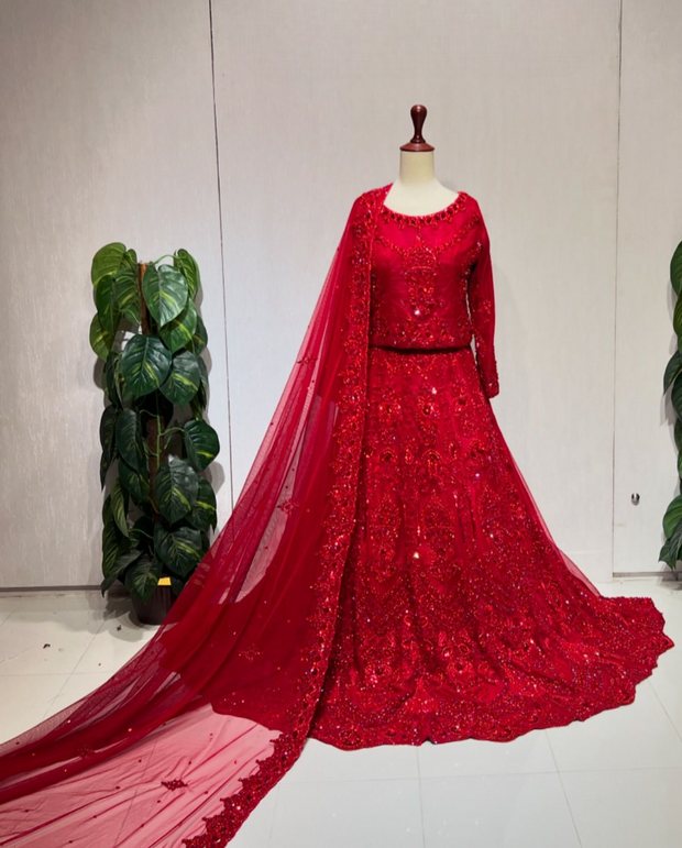 Latest Pakistani Bridal Dress in Red Choli and Lehenga Style