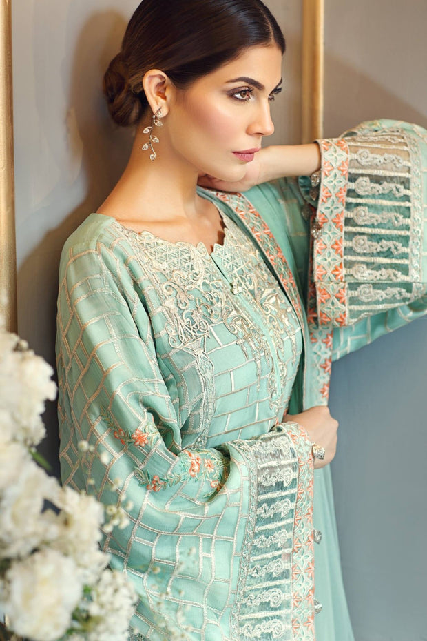 Chiffon dress by Anaya in ferozee turquoise color with threds embroidery and cutwork patches Model# C 571